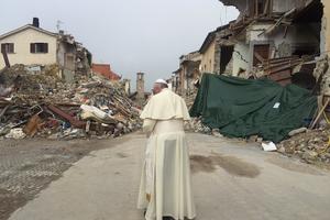 Pope Francis praying in front of rubble in Amatrice, Oct. 4, 2016.  