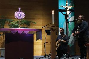 Lee Roessler and Dave Moore play music during adoration Sept. 26 in Rochester, N.Y. 