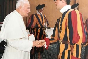 Pope John Paul II shakes the hand of Swiss guard, Mario Enzler, 1990. 