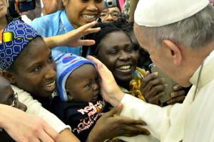 Pope Francis greets pilgrims before his general audience in the Paul VI Hall on Aug. 19.