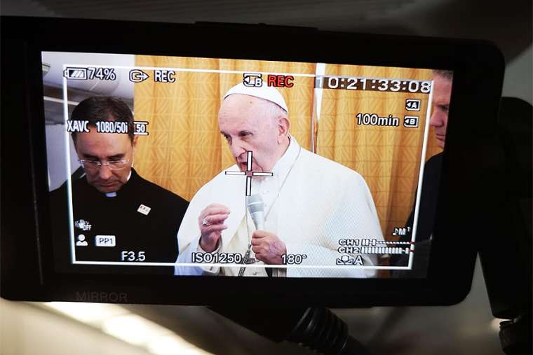Pope Francis on the return flight from his trip to Geneva, Switzerland, June 21.