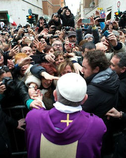 Pope Francis greets people after celebrating Mass at St. Anne's parish on March 17.