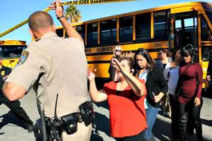 Employees evacuated by bus from site of mass shootings at Inland Regional Center in San Bernardino, Calif., on Dec. 2.

