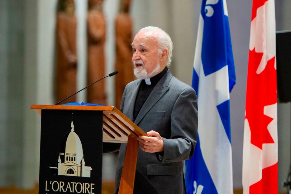 Father Claude Grou, shown speaking at a March 1 news conference about the work to be done at St. Joseph's Oratory in Montreal, was stabbed during a livestreamed morning Mass at the oratory. He has been released from the hospital.