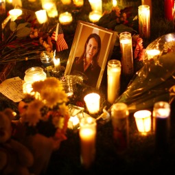VIGIL. A picture of U.S. Rep. Gabrielle Giffords, D-Ariz., is surrounded by candles during a vigil outside the Tucson University Medical Center in Arizona Jan. 9. Giffords was in critical condition at the medical center after being shot in the head by Jared Lee Loughner, 22. He is accused of killing six people and wounding 14 others in the Jan. 8 shooting rampage. 