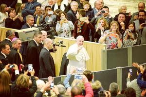 Pope Francis greets the faithful at indoor Jan. 20 general audience.
