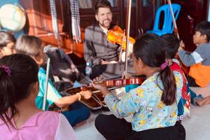 Father Will Conquer enjoys fellowship in Cambodia, from teaching violin to children every Wednesday in Boeung Tompun, accompanying youth to see Pope Francis in Thailand or celebrating the patronal feast day of the Sisters of Providence. 

