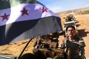 Turkish-backed Syrian rebel fighters head to an area near the Syrian-Turkish border north of Aleppo on Oct. 8. U.S. forces in northern Syria started pulling back from areas along the Turkish border ahead of the Turkish invasion.
