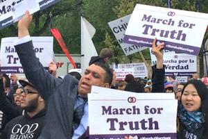 Crowds hold signs in defense of traditional marriage at the March for Marriage in Washington on Saturday.