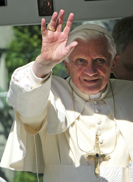The Holy Father waves to the crowd from the popemobile as he arrives to visit the Freiburg Cathedral, September 24, 2011.