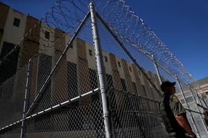 An armed California Department of Corrections and Rehabilitation officer stands guard at San Quentin State Prison's death row Aug. 15, 2016, in San Quentin, California. San Quentin State Prison opened in 1852 and is California's oldest penitentiary. The facility houses the state's only death row for men. 