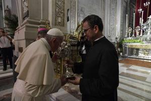 Pope Francis venerates a relic at the Palermo cathedral during his meeting with clerics, religious and seminarians Sept. 15. 