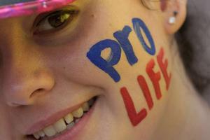 Young woman takes part in a pro-life rally in Ireland. 