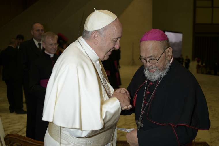 Pope Francis greets the then-Archbishop of Agana, Anthony Apuron, at the Vatican Feb. 7, 2018