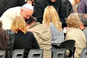 Pope Francis embraces the sick at a general audience in St. Peter’s Square. 
