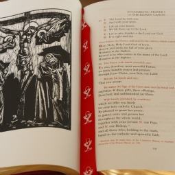 The new English translation of the Roman Missal is seen at its presentation to Pope Benedict XVI at the Vatican April 28. The new English edition is a translation of the Latin edition promulgated by Pope John Paul II in 2002. The new translation, which a dheres more exactly to the Latin, took eight years to produce.