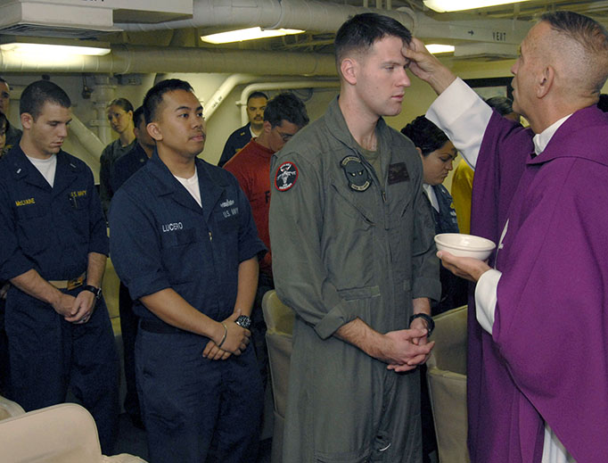 Sailors and Marines prepare to receive ashes during Ash Wednesday Mass aboard the amphibious assault ship USS Boxer (LHD 4) in 2009. (U.S. Navy photo by Mass Communication Specialist 2nd Class John J. Siller/Released)