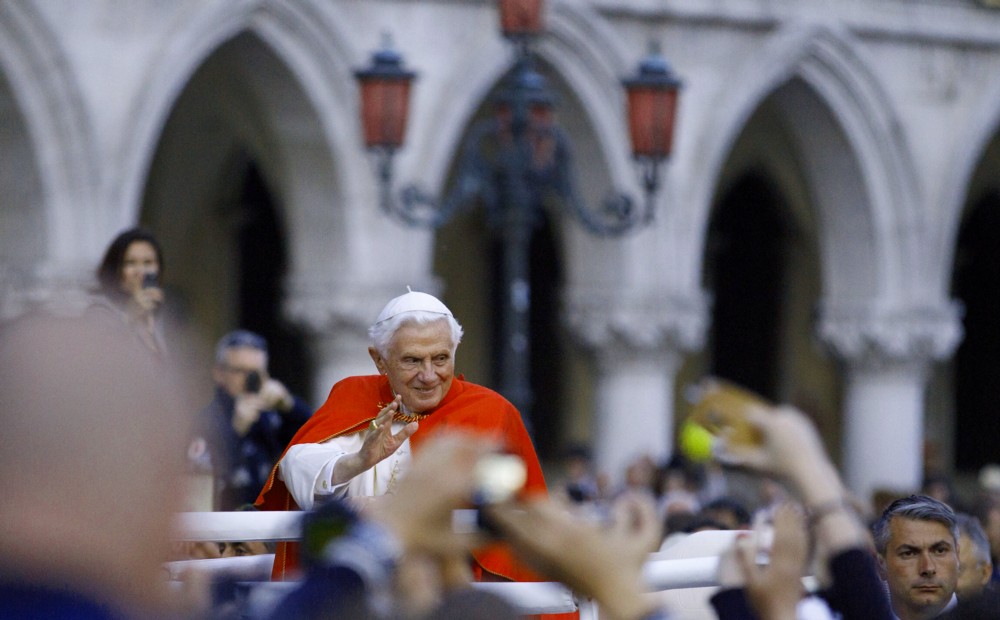 Pope Benedict XVI greets the crowd as he arrives in St. Mark's Square in Venice May 7.