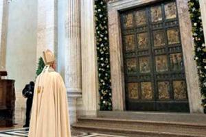 Pope Francis before the holy door of St. Peter's Basilica during the convocation of the Jubilee of Mercy, April 11