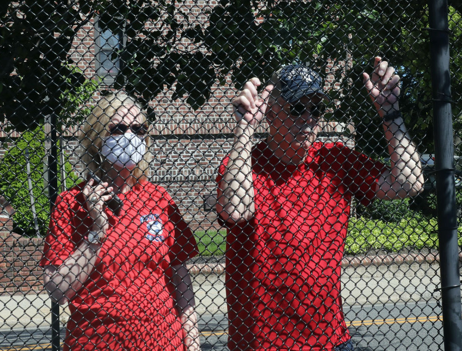 Parishioners attend Sunday morning Mass (with audio provided by cell phone) from outside the gates at the parking lot at the Parish of Saint Agnes Cathedral on May 31 in Rockville Centre, New York. New York State regulations require that attendees on the site remain in their cars during Mass as the parish remains mostly closed due to the coronavirus pandemic.
