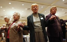 ‘OPPRESSED CLASS?’ Women recite the Lord's Prayer during Mass at the Voice of the Faithful national conference in Melville, N.Y., in 2009.