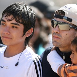 GRATEFUL. Rescued Chilean miner Alex Vega, center, arrives with family members to the San Jose mine in Copiapo, Chile, Oct. 17. Some of the 33 miners rescued last week after 69 days trapped underground returned to the copper and gold mine for a Mass of thanksgiving. 