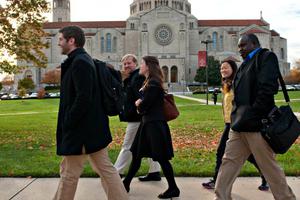 Students from the Pontifical John Paul II Institute for Studies on Marriage and Family, on the campus of The Catholic University of America, walk past the Basilica of the National Shrine of the Immaculate Conception in Washington.
