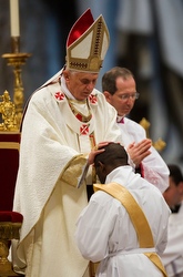 The Pope with one of the 19 new priests he ordained May 3 in St. Peter's Basilica.