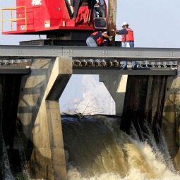 Members of the U.S. Army Corps of Engineers open up bays along the Mississippi River to the Bonnet Carre spillway in Narco, La., May 9. The Mississippi River was approaching record flood levels and forcing area residents from their homes. 