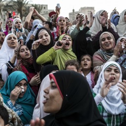 Egyptian supporters of the Muslim Brotherhood react to speeches at a gathering to celebrate a premature victory for their presidential candidate Mohamed Morsi in Tahrir Square in Cairo June 19. Egyptian candidates Mohamed Morsi and Ahmed Shafiq contested in the second round of voting for the country's president held over two days of voting last weekend. Despite official results not having been announced, the Muslim Brotherhood are claiming victory for their presidential candidate Mohamed Morsi.
