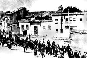 Armenians are marched to a nearby prison in Mezireh by armed Turkish soldiers. Kharpert, Armenia, Ottoman Empire, April, 1915