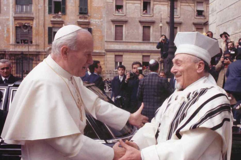 John Paul greets Rabbi Elio Toaff at Rome's main synagogue in 1986.