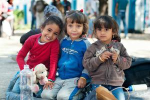 Children from Syria at a park near the Belgrade, Serbia bus terminal.