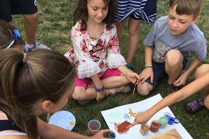 Marie Hain instructs young students on powdered pigments and iconography as Marie Miller teaches songwriting to young students during last year’s Brillante.