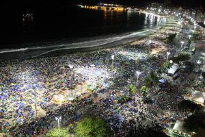 Pilgrims pray and sleep overnight on Copacabana Beach during World Day on July 27, 2013.