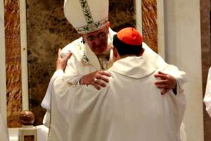 Pope Francis and Cardinal Luis Antonio Tagle embrace at the close of Mass Jan. 16 in Manila.
