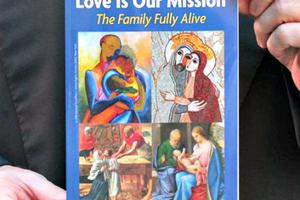 Archbishop Charles Chaput and the World Meeting of Families catechesis book in Rome on Sept. 15.
