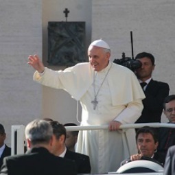Pope Francis greets pilgrims during his Sept. 25 general audience.