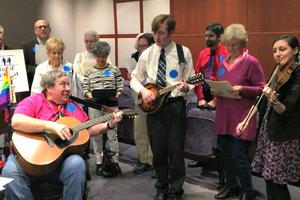 Opponents to assisted suicide take a break to jam at the state Capitol.