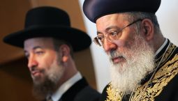 Israel's Sephardi Chief Rabbi Shlomo Amar (r) attends a news conference with Ashkenazi Chief Rabbi Yona Metzger at the Ciampino airport, south of Rome, Sept. 15, 2005, after a private meeting with Pope Benedict in his summer residence of Castel Gandolfo. The rabbis urged Pope Benedict to forcefully deplore the destruction of synagogues in Gaza by Palestinians after the Israeli withdrawal.