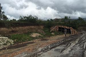 Damage to the landscape (above) and a church (below) in the Diocese of Anse-à-Veau et Miragoâne, Haiti, indicate the aftermath of the hurricane; also shown: Sean Forrest of Haiti180, which runs a medical clinic and an orphanage, and a young orphan.