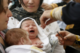Babies are baptized in Holy Trinity Orthodox Cathedral in Tbilisi, Georgia.