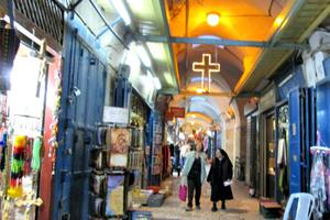 Christian shopkeepers in the Old City of Jerusalem say tourism is way down. The alleyways leading to the Church of the Holy Sepulcher are much less crowded than usual at this time of year.

