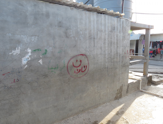 The "N" symbol on a house in Erbil, Iraq, in April 2016. The word "Nasrani" is the Arabic word for Christian and the "N" symbol has been used to mark the houses and property of Christians in Iraq.