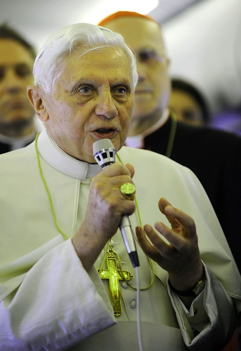 Pope Benedict XVI speaks to reporters on a plane en route to Portugal May 11. The Pope made some of his strongest remarks to date on the sex abuse cases during an in-flight press conference en route to his four-day visit.