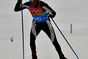 Rebecca Dussault competes in the cross-country skiing event at the 2006 Winter Olympics in Turin, Italy.

