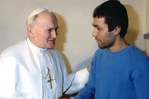Pope John Paul II greets his would-be assassin, Mehmet Ali Agca, at Rebibbia Prison in Rome, Dec. 27, 1983.