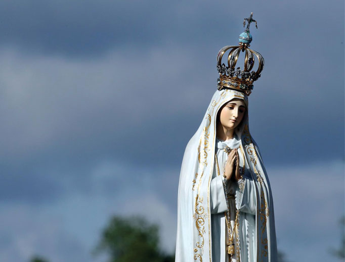 The statue of the Virgin Mary is carried in procession by the faithful prior to the start of a Mass at the Sanctuary of Our Lady of Fatima May 13, 2017, in Fatima, Portugal, to commemorate 100 years since the Marian apparitions began there. 