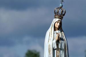 The statue of the Virgin Mary is carried in procession by the faithful prior to the start of a Mass at the Sanctuary of Our Lady of Fatima May 13, 2017, in Fatima, Portugal, to commemorate 100 years since the Marian apparitions began there. 