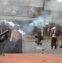 Protesters clash with riot police on Feb. 15 in Altamira, Caracas, Venezuela.